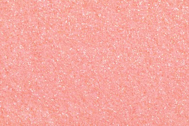 Photo of Beautiful pink shiny glitter as background, top view