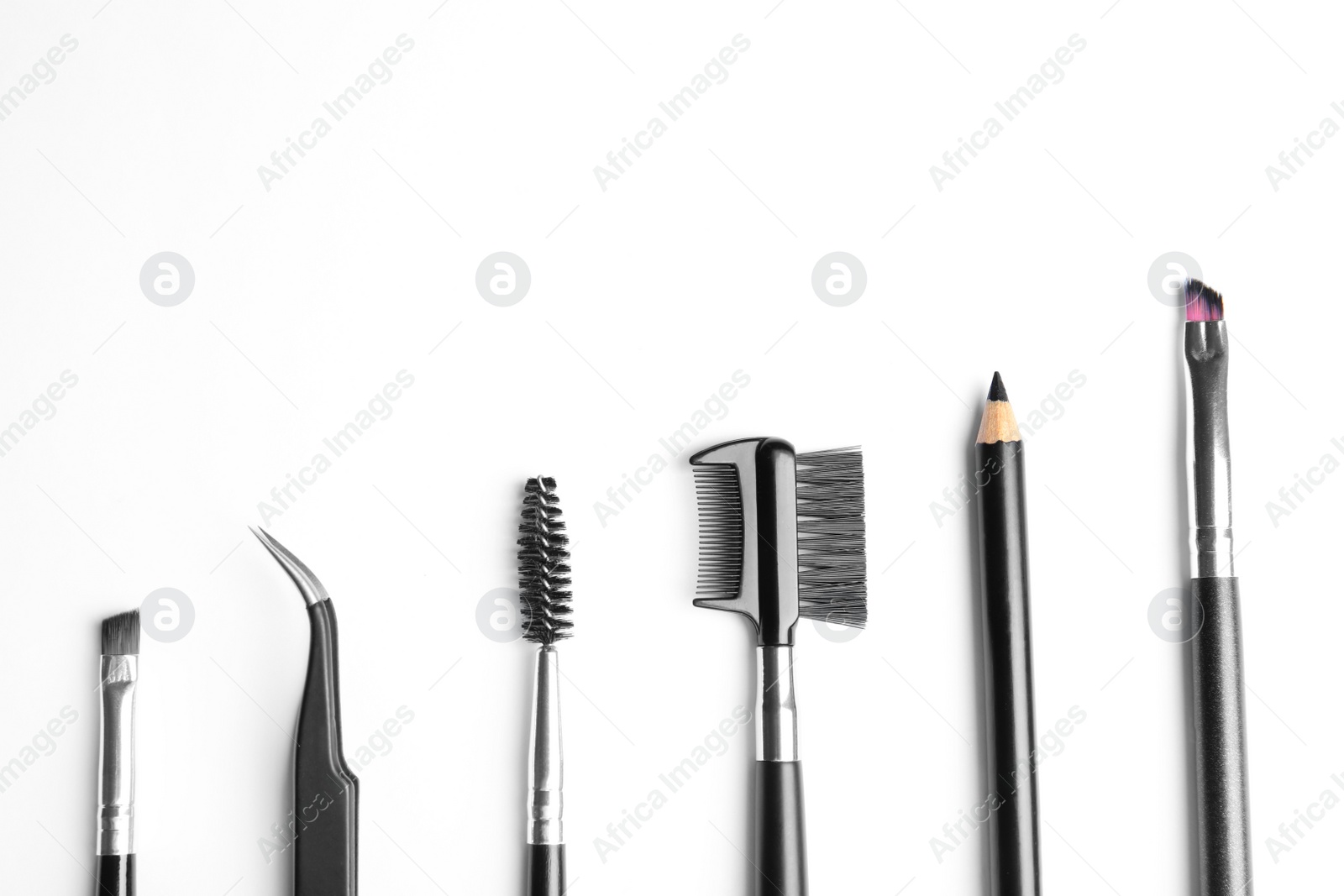 Photo of Set of professional eyebrow tools on white background, top view
