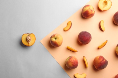 Photo of Flat lay composition with fresh peaches on color background