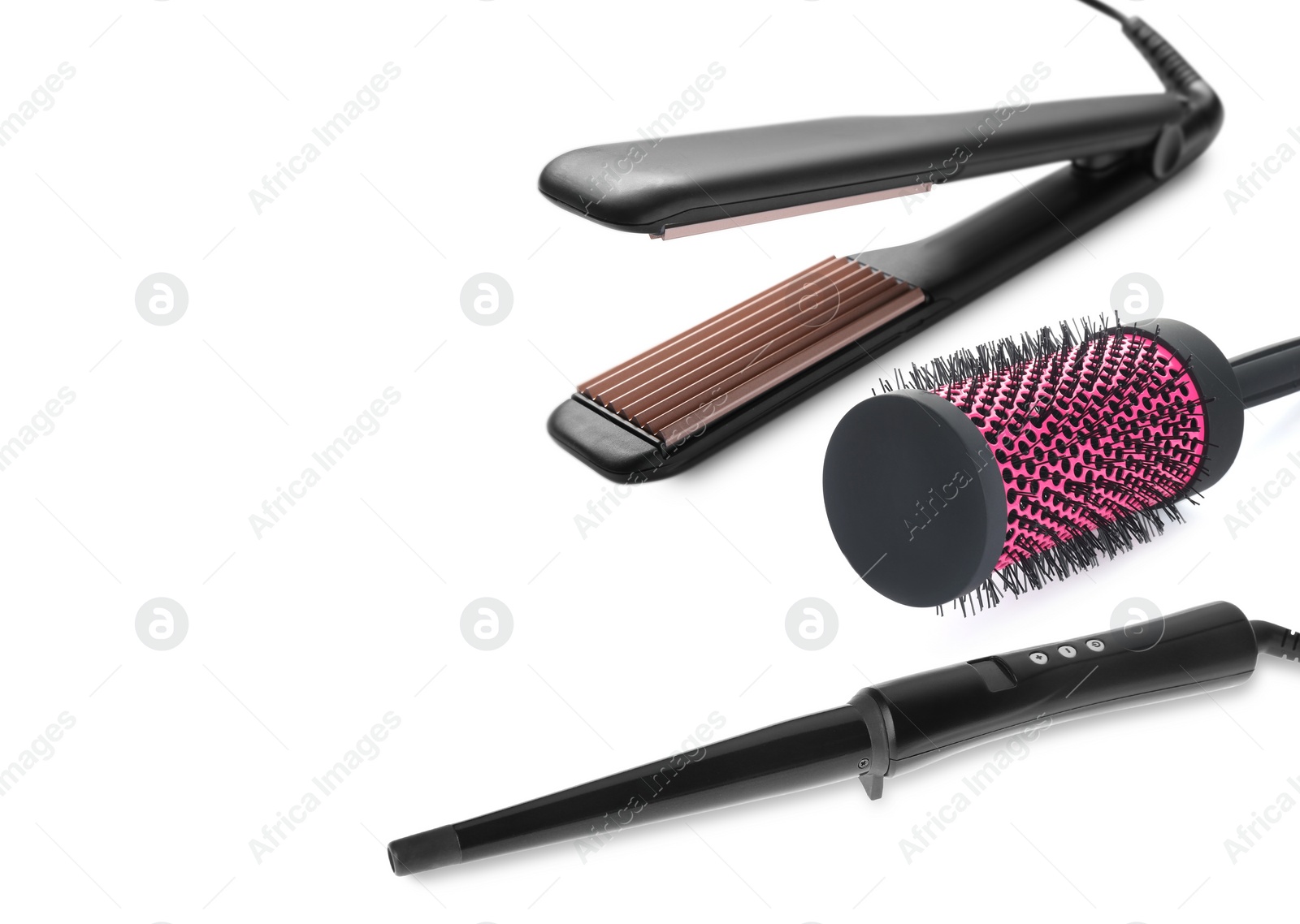 Image of Hair irons and round brush on white background