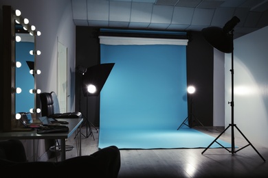 Modern photo studio interior with professional lighting equipment