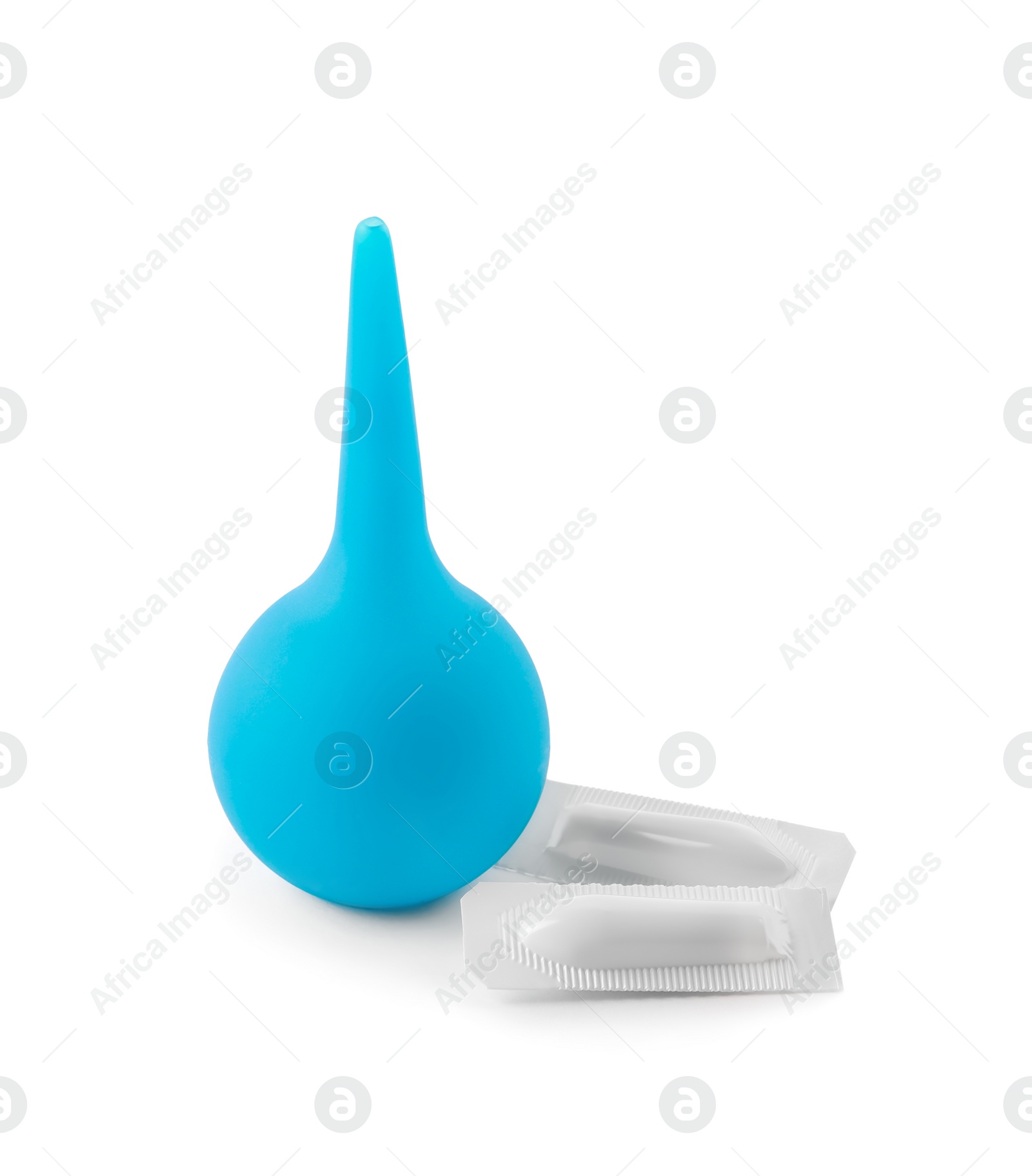 Photo of Light blue enema and suppositories on white background