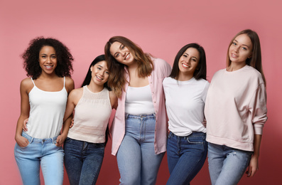 Photo of Group of women with different body types on pink background