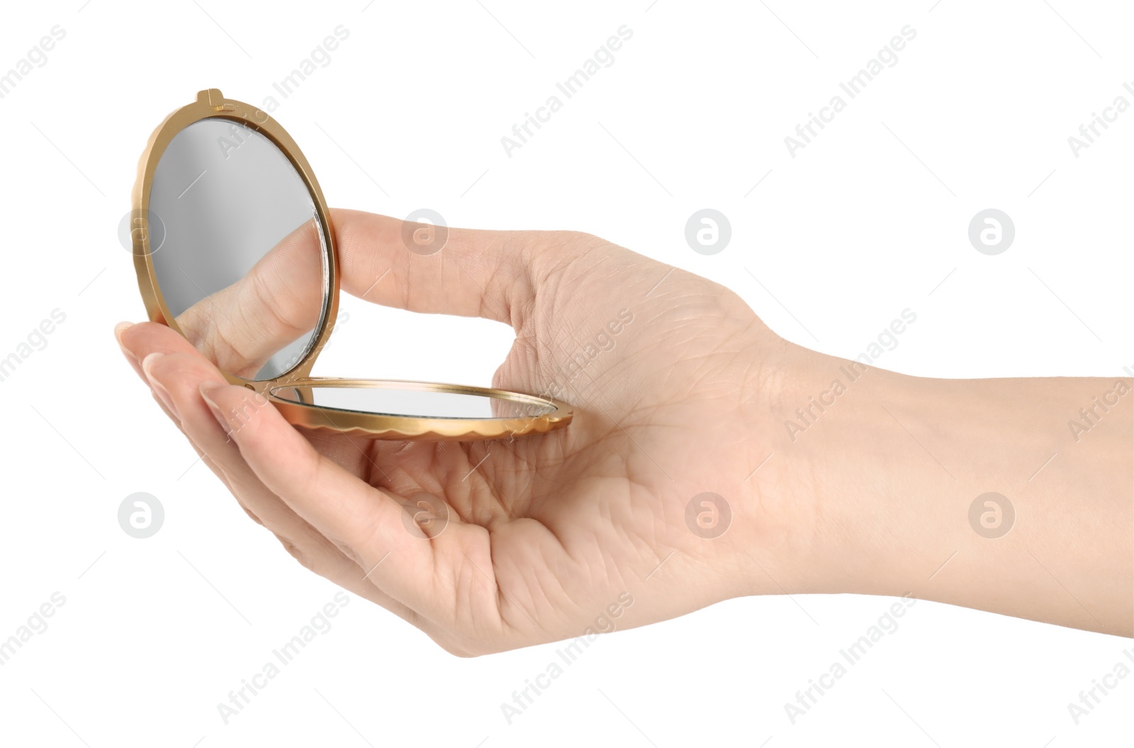 Photo of Woman holding gold cosmetic pocket mirror on white background, closeup