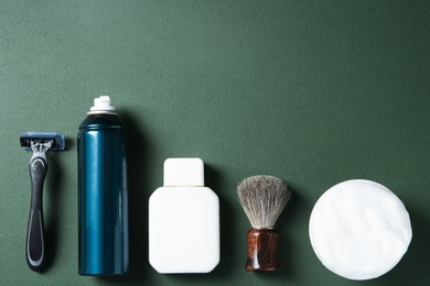 Photo of Flat lay composition with shaving accessories for men on color background. Space for text