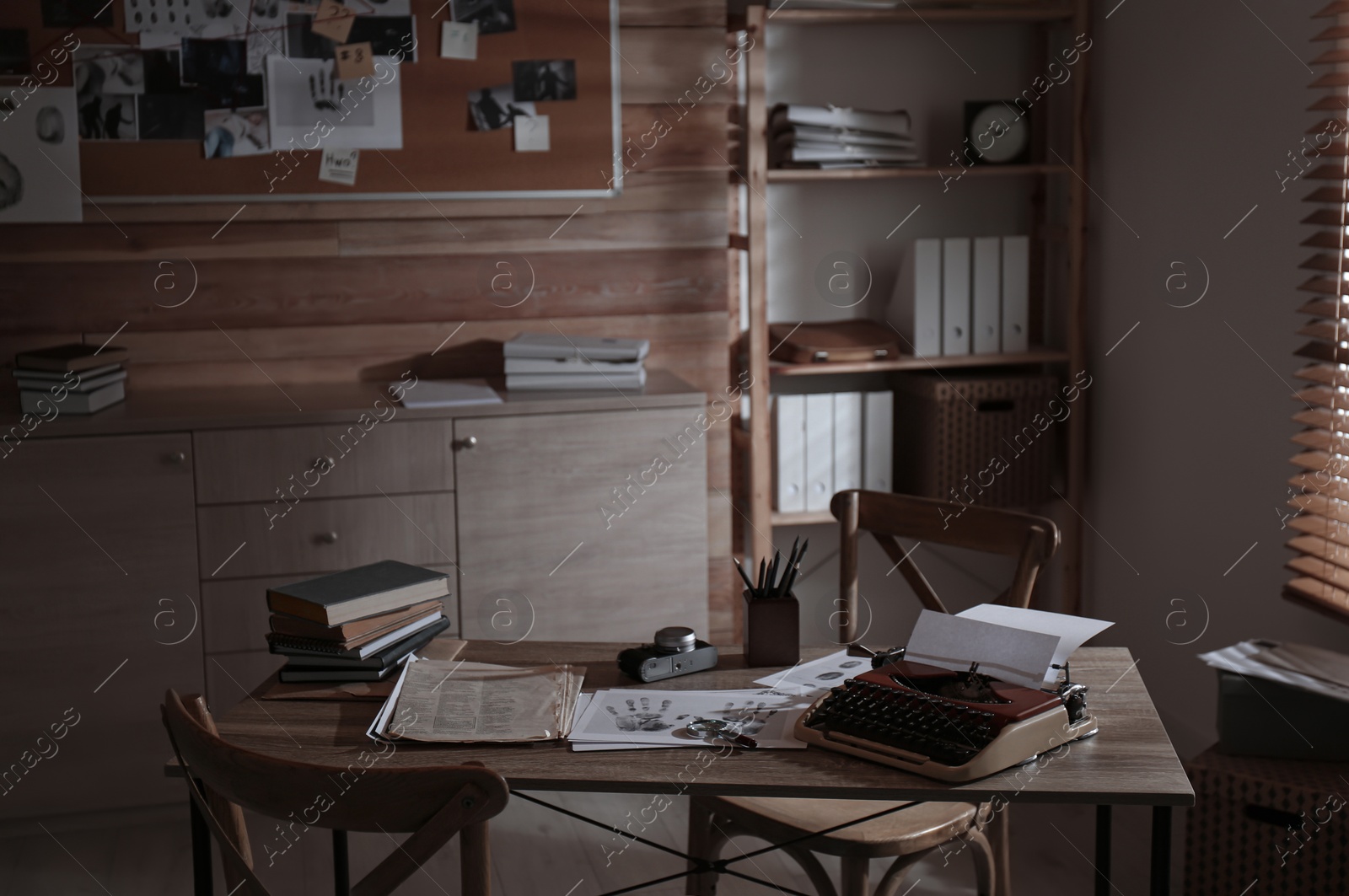 Photo of Detective's office interior with wooden desk and evidence board
