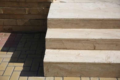 Photo of Beautiful concrete stairs near stone pavement outdoors