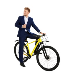 Young businessman with bicycle on white background