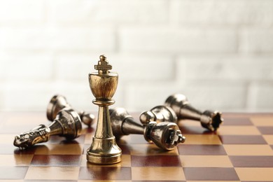 Photo of Chessboard with game pieces on light background
