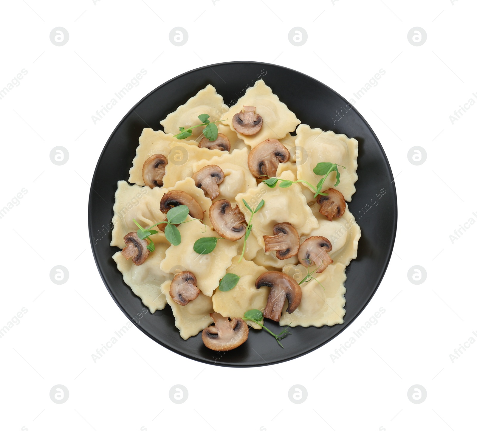 Photo of Plate of delicious ravioli with mushrooms isolated on white, top view