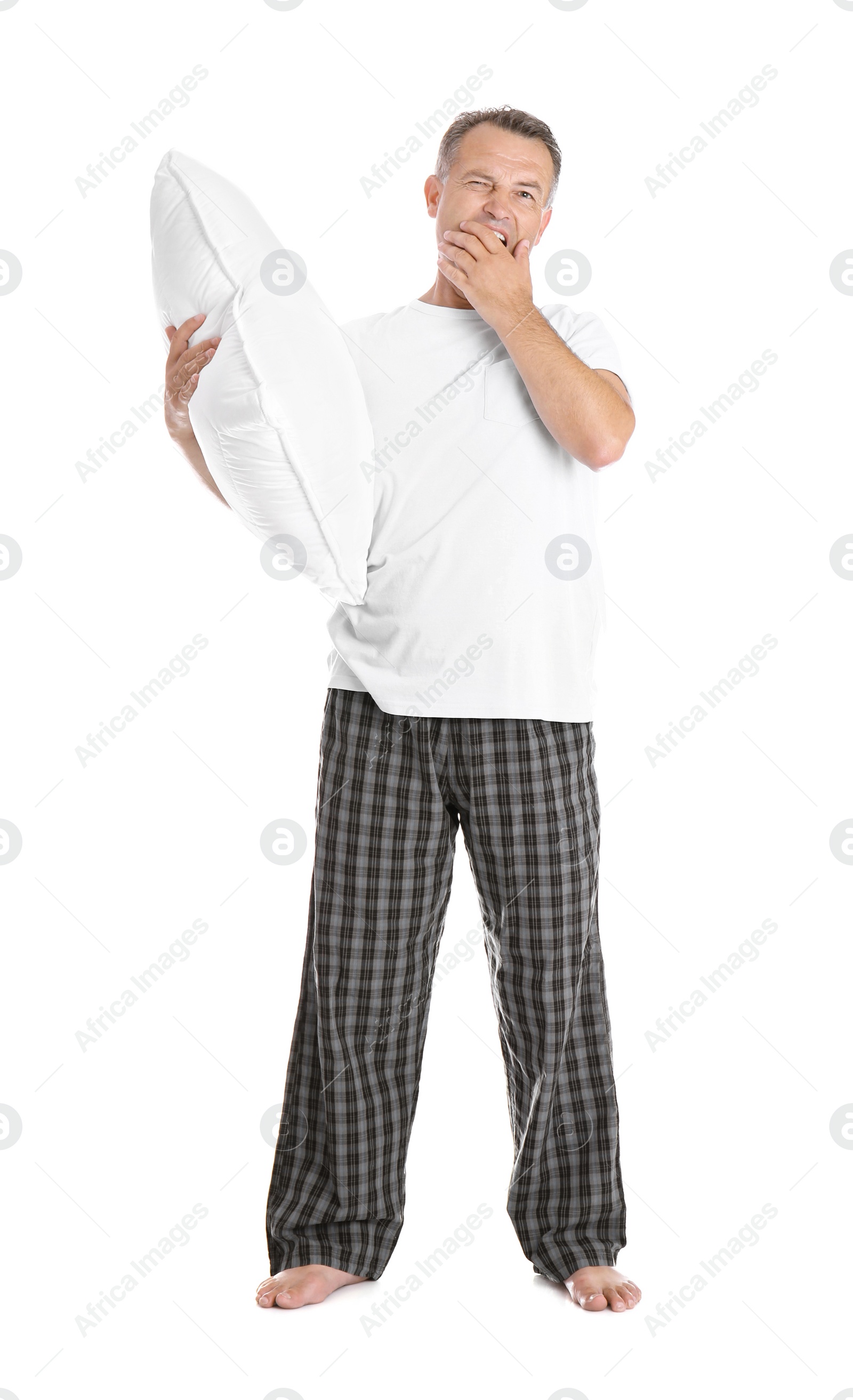 Photo of Man holding soft pillow on white background