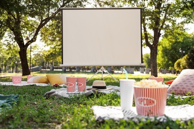 Photo of Big screen in open air cinema. Space for text