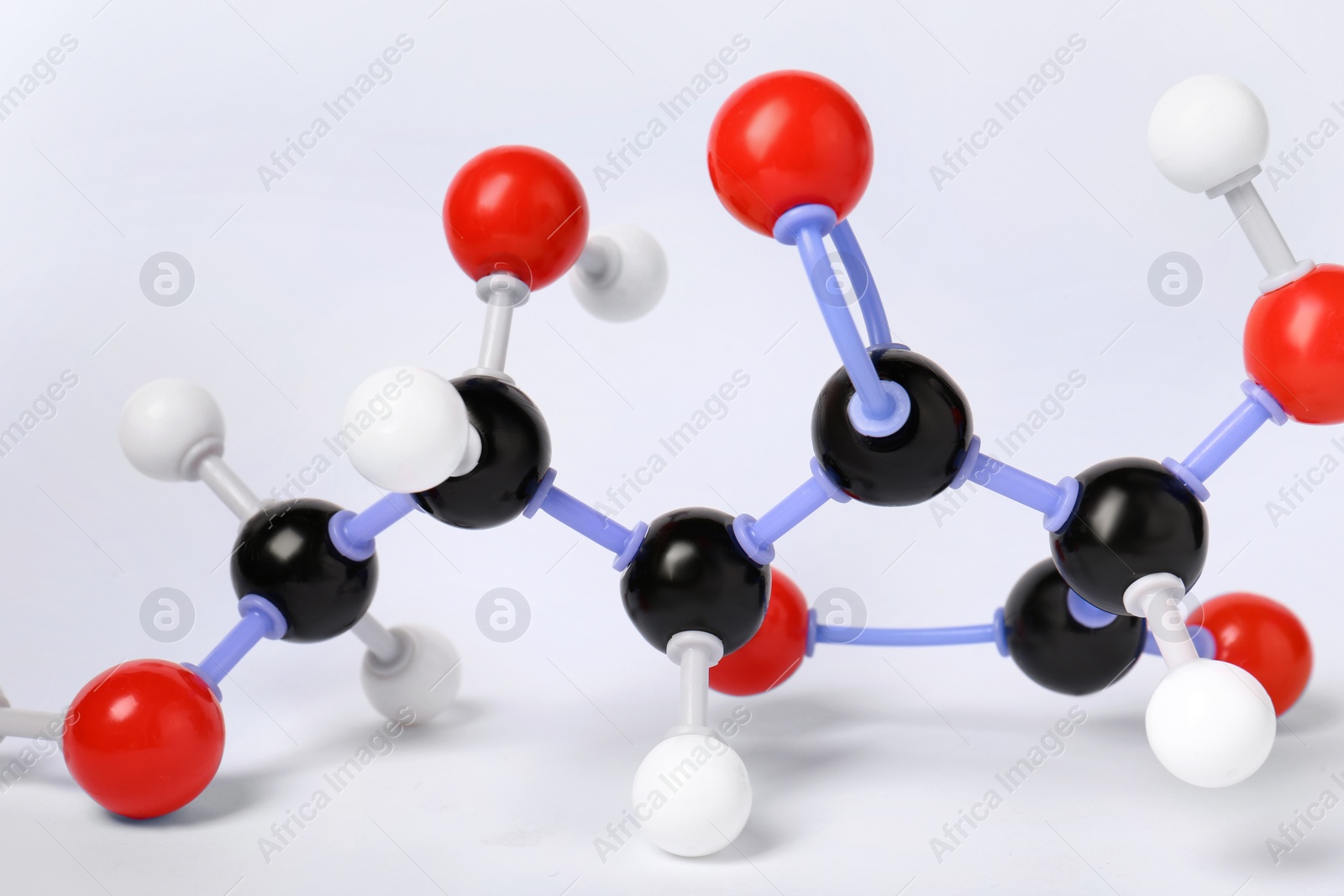 Photo of Molecule of vitamin C on white background, closeup. Chemical model