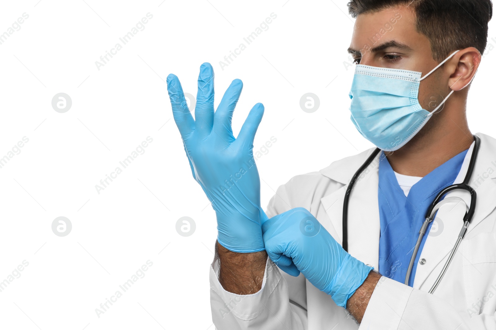 Photo of Doctor in protective mask putting on medical gloves against white background