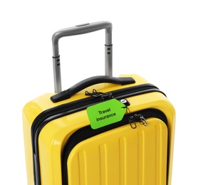 Photo of Yellow suitcase with TRAVEL INSURANCE label on white background