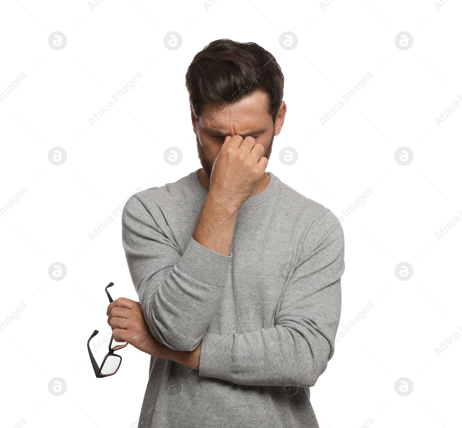 Photo of Man suffering from eyestrain on white background