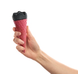 Photo of Woman holding yummy ice cream on white background. Focus on hand