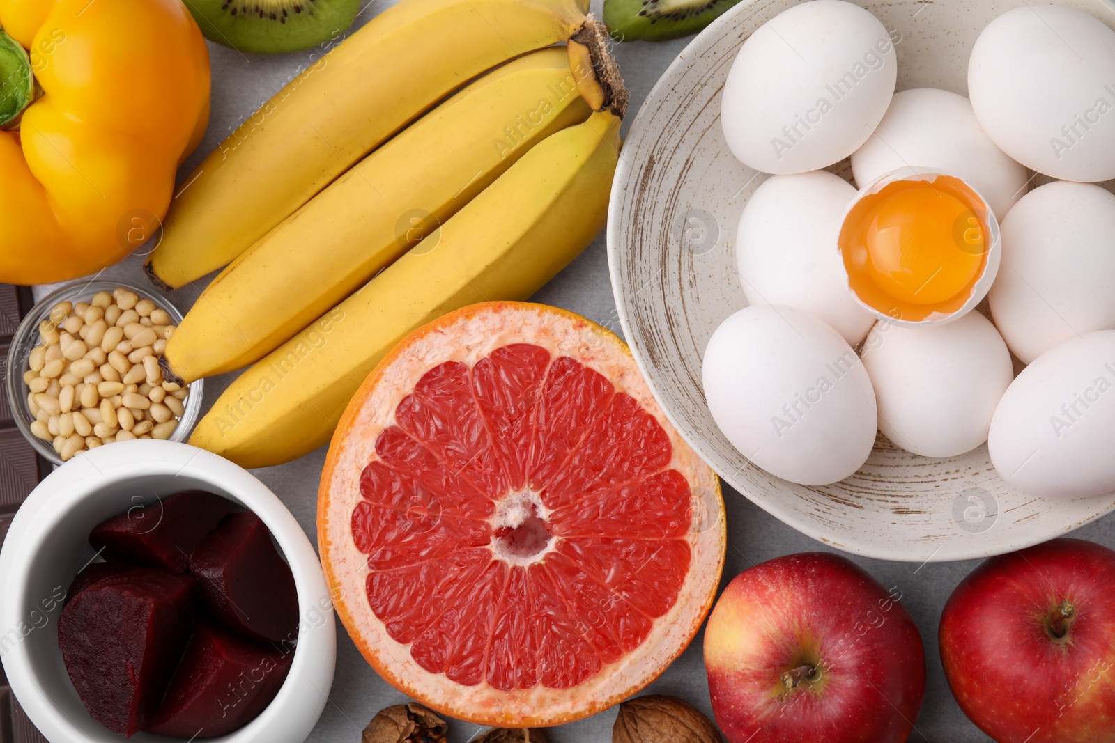 Photo of Many different products on table, flat lay. Natural sources of serotonin