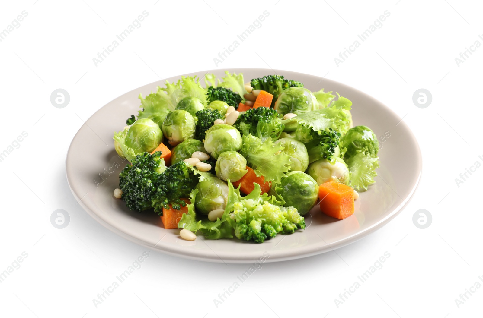 Photo of Plate of salad with Brussels sprouts isolated on white