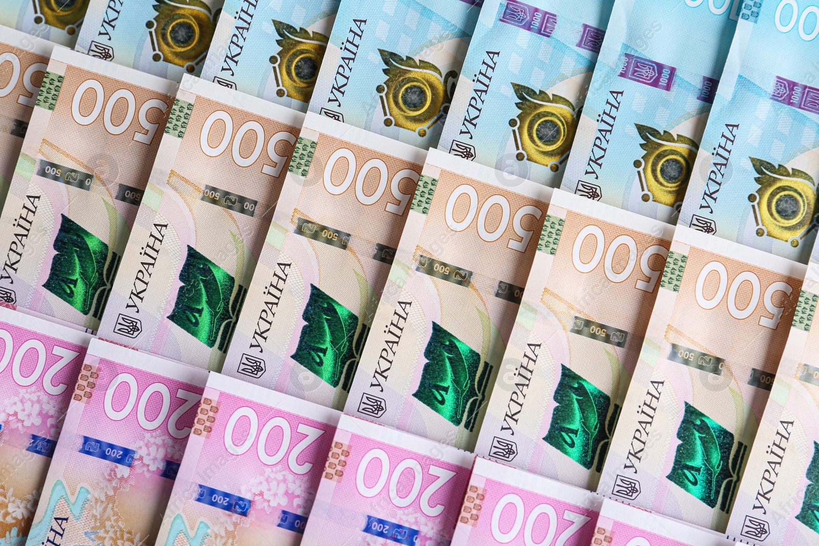 Photo of Closeup view of Ukrainian money as background. National currency