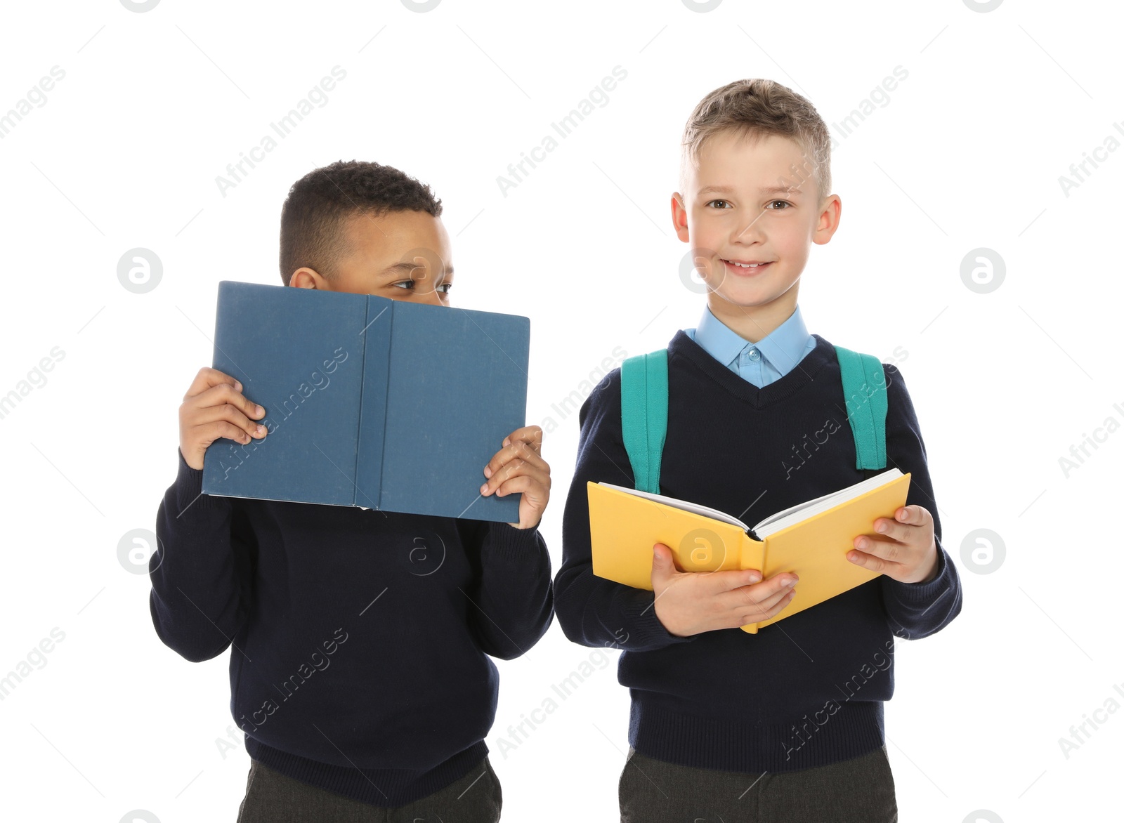 Photo of Portrait of cute children in school uniform with books on white background