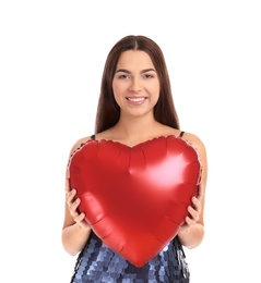 Portrait of young woman with heart shaped balloon on white background