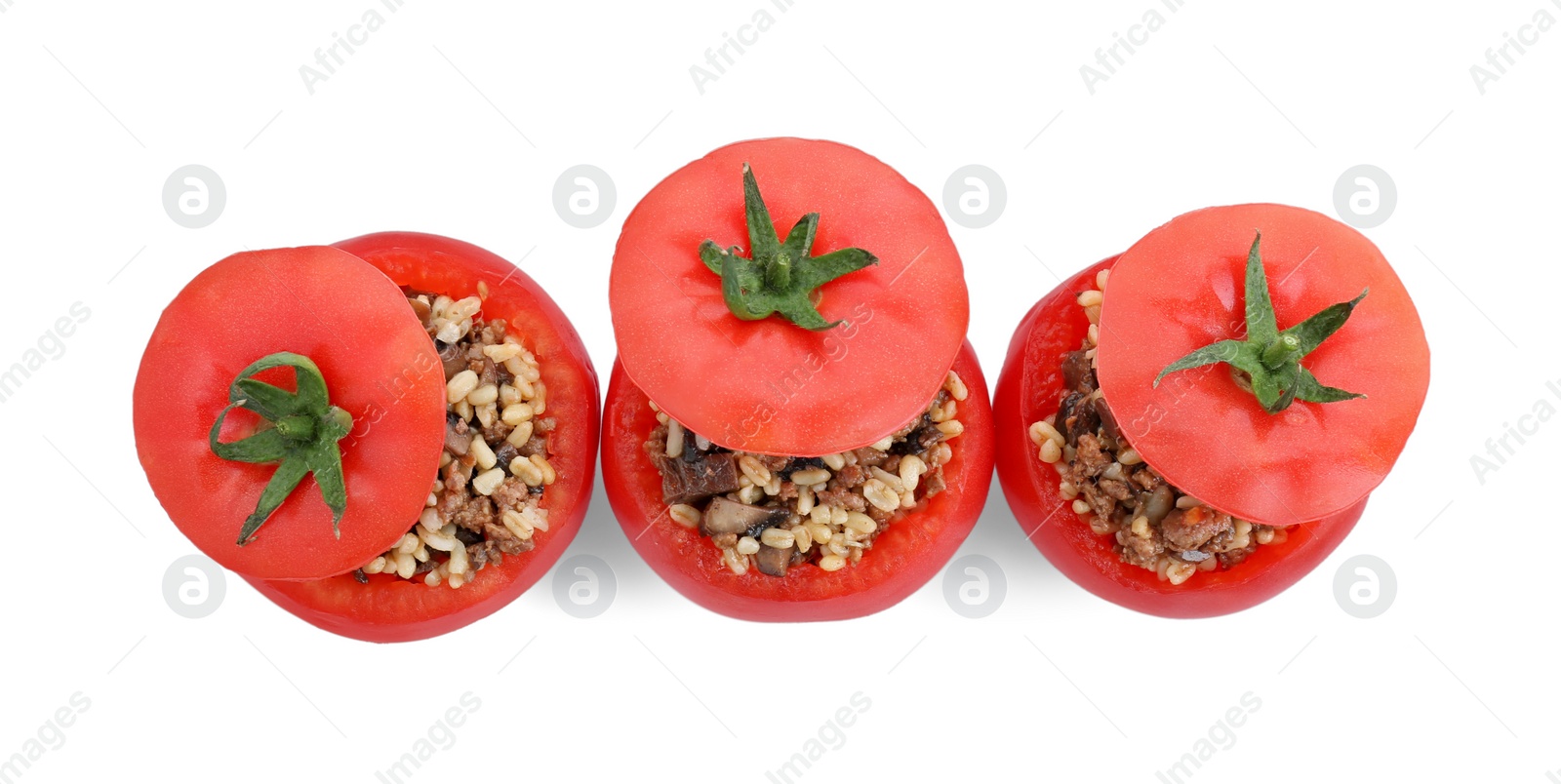 Photo of Delicious stuffed tomatoes with minced beef, bulgur and mushrooms isolated on white, top view