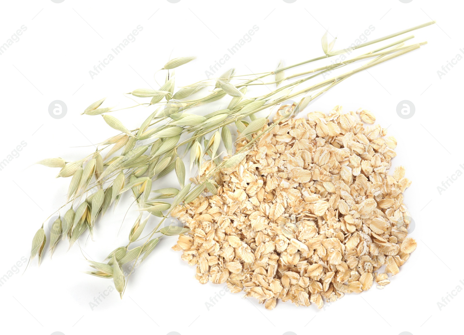 Photo of Oatmeal and branches with florets isolated on white, top view