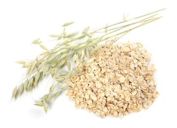 Photo of Oatmeal and branches with florets isolated on white, top view