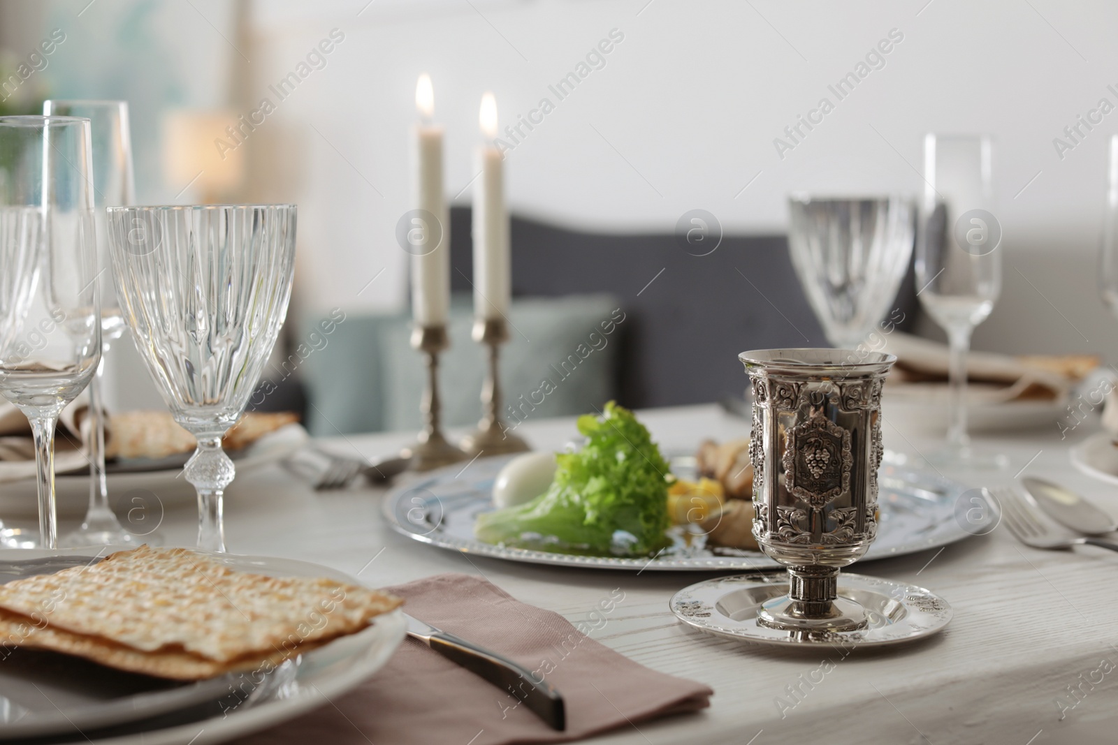 Photo of Festive Passover table setting at home. Pesach celebration