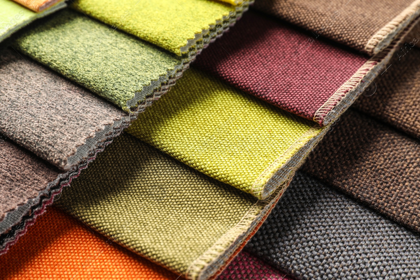 Photo of Fabric samples of different colors for interior design as background