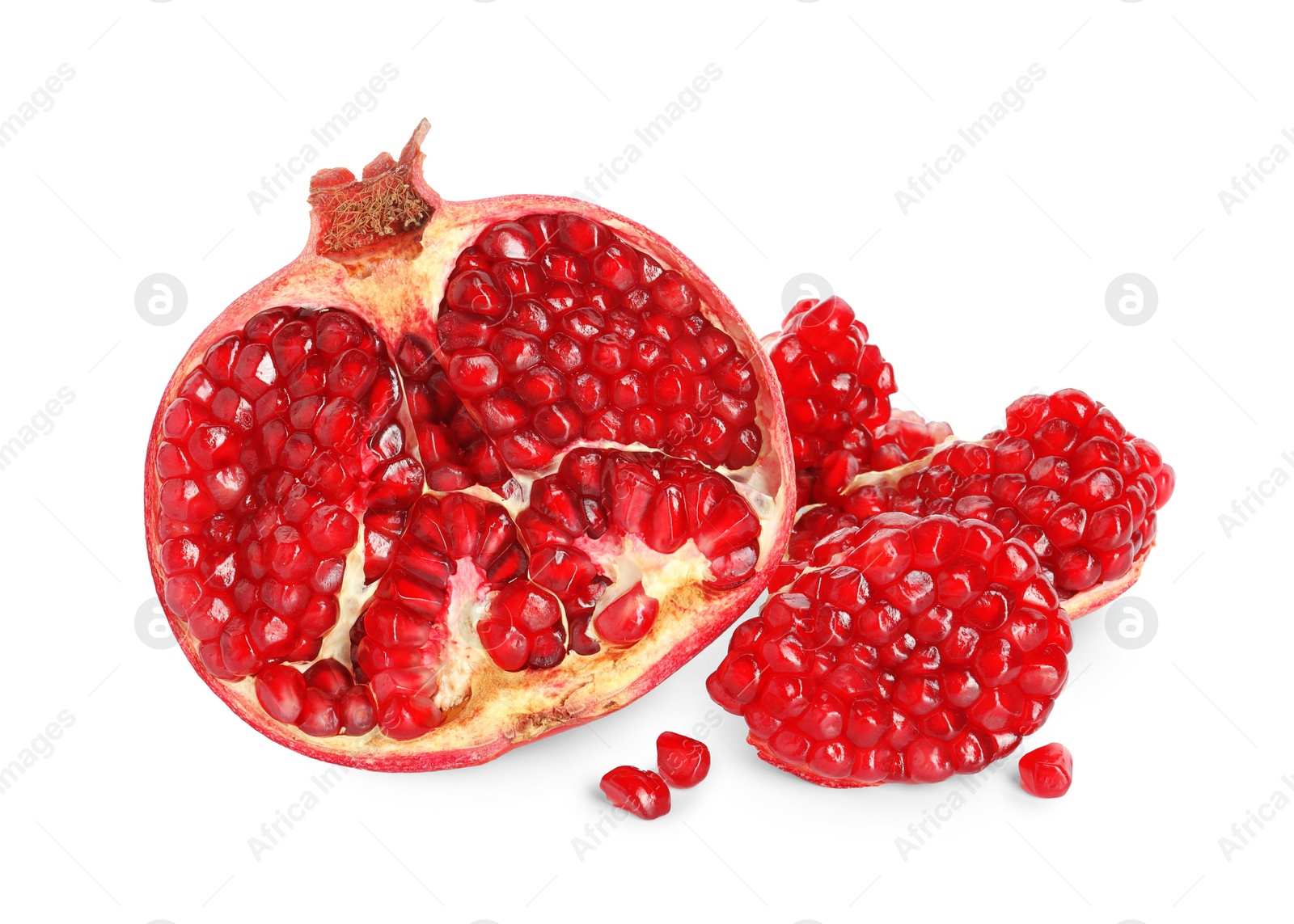 Photo of Fresh cut pomegranate with juicy seeds isolated on white