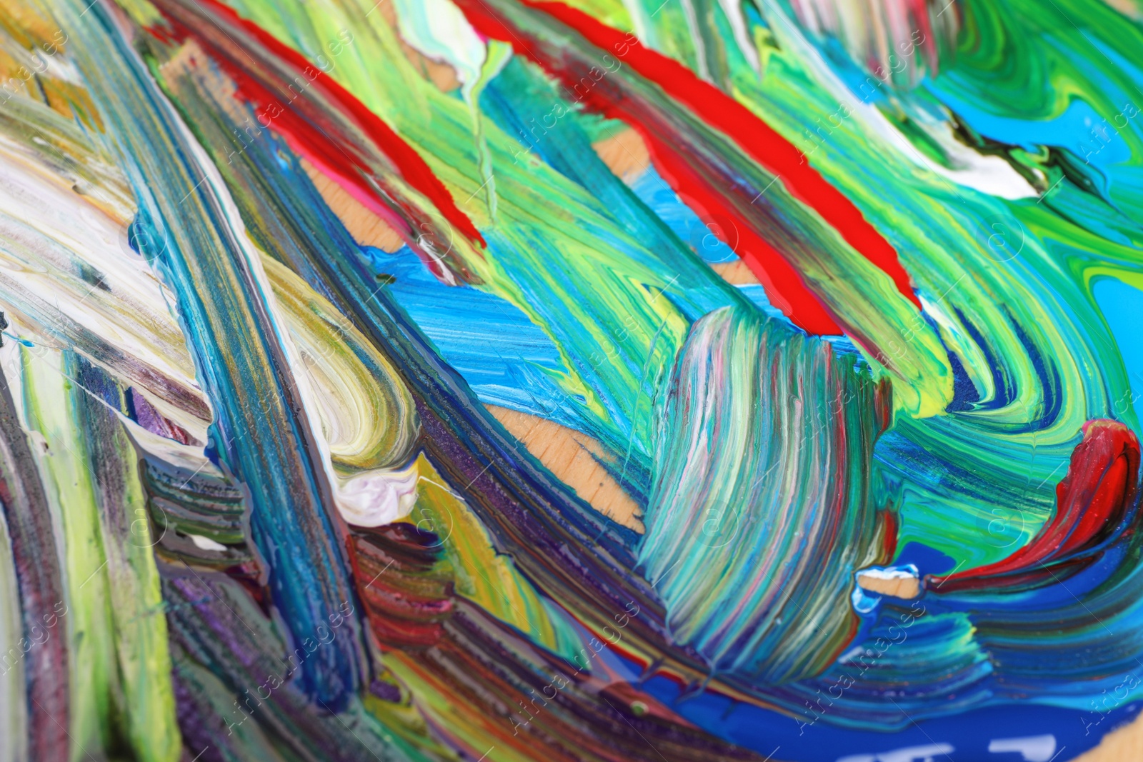 Photo of Abstract colorful acrylic paint as background, top view