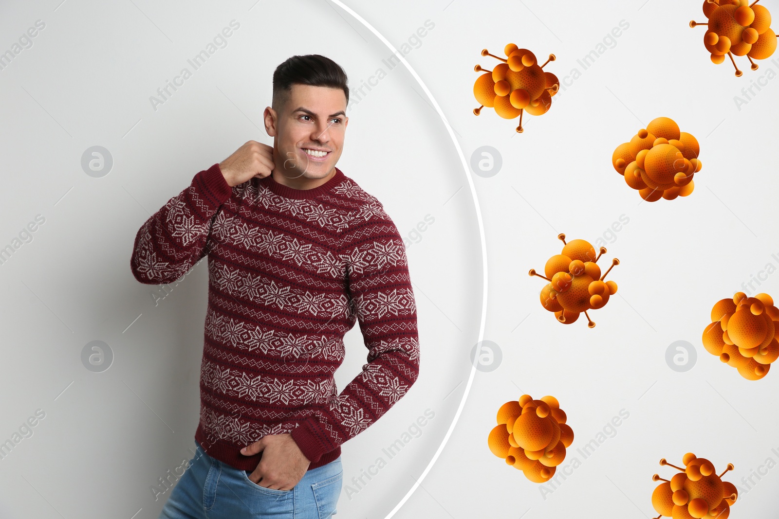 Image of Man with strong immunity surrounded by viruses on light background