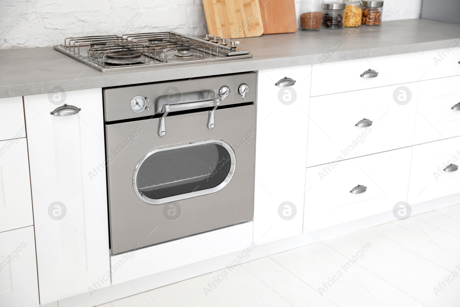 Photo of New modern oven in stylish kitchen. Cooking appliance