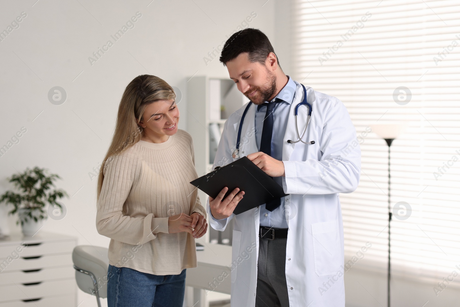 Photo of Professional doctor working with patient in hospital