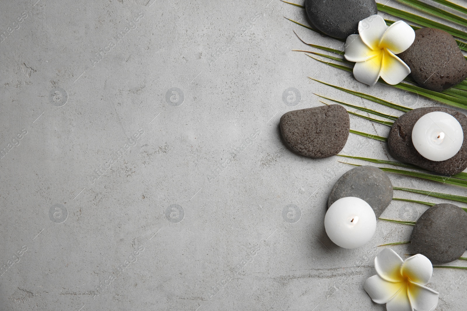 Photo of Flat lay composition with stones on grey background, space for text. Zen concept