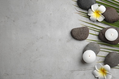 Photo of Flat lay composition with stones on grey background, space for text. Zen concept