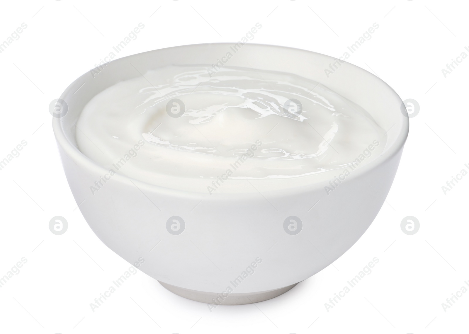 Photo of Bowl with delicious organic yogurt isolated on white