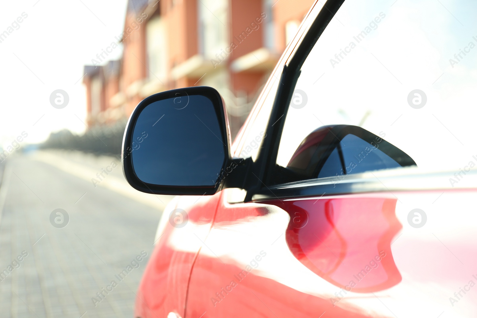 Photo of Side rear view mirror of modern car outdoors