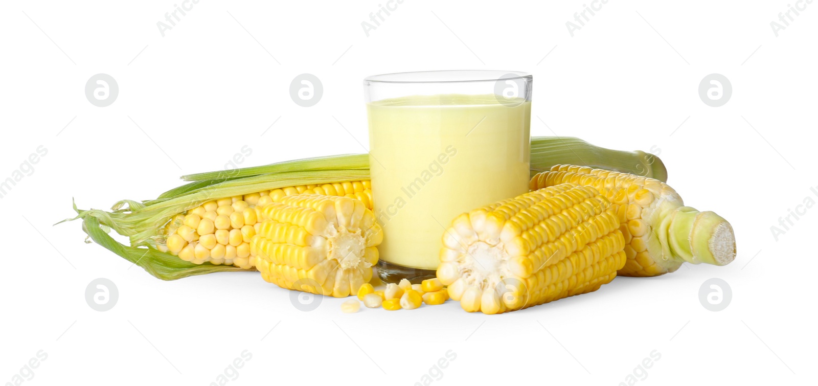 Photo of Tasty fresh corn milk in glass and cobs on white background