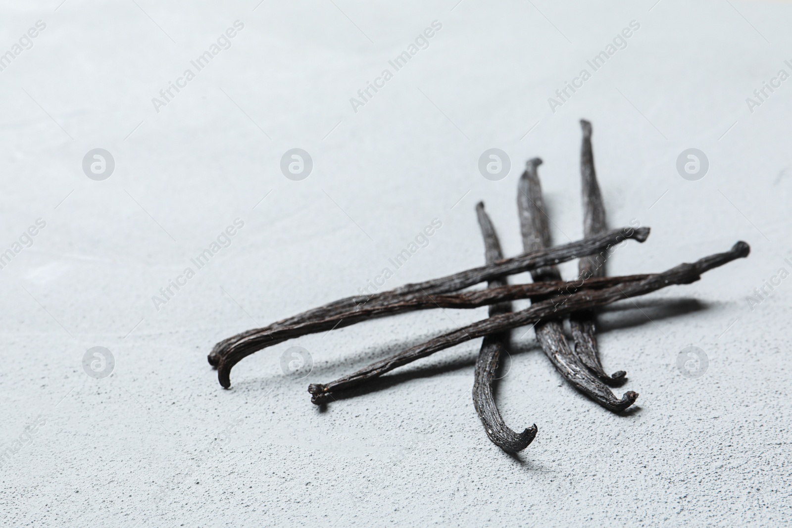 Photo of Vanilla sticks on light background