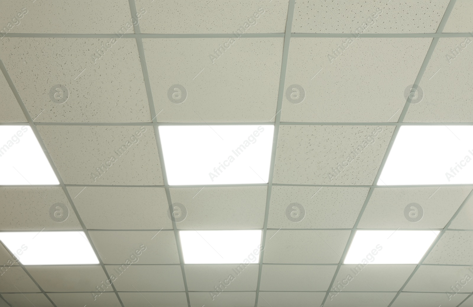 Photo of White ceiling with lighting in office room