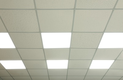 White ceiling with lighting in office room