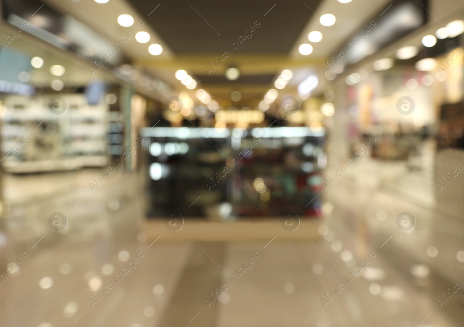 Photo of Blurred view of modern shopping mall interior. Bokeh effect