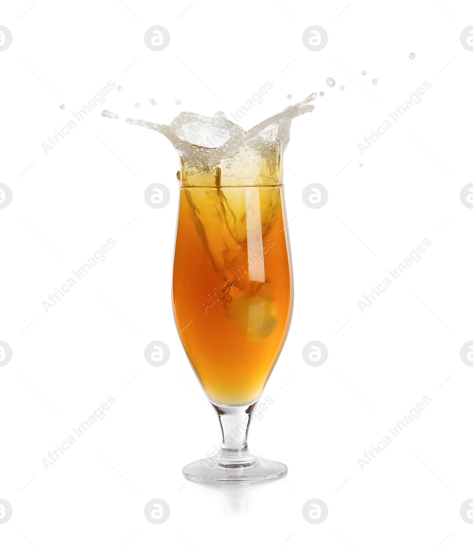 Photo of Beer splashing out of glass on white background