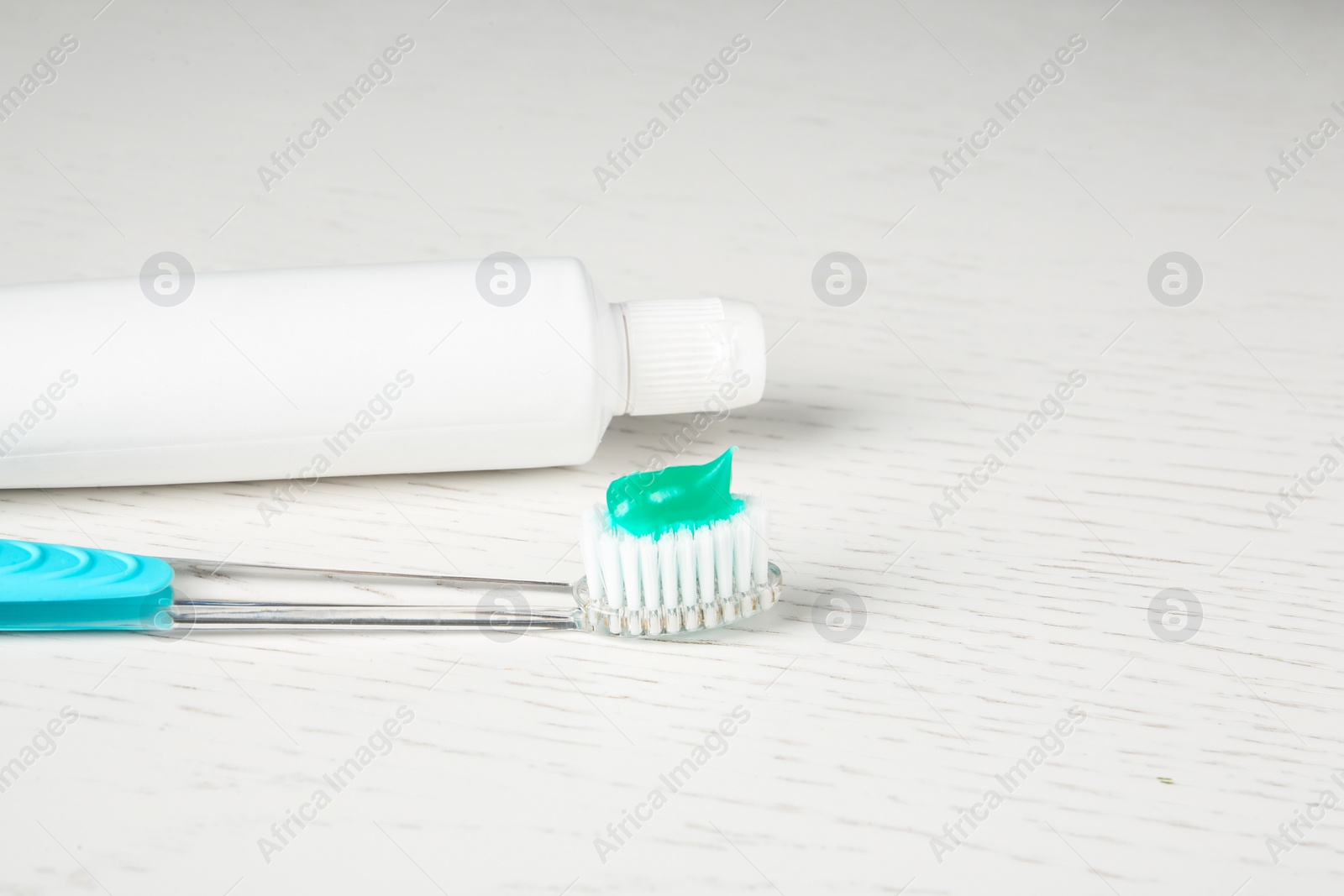 Photo of Manual toothbrush and paste on table. Dental care