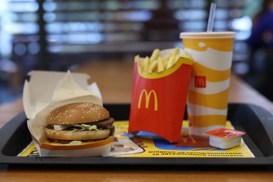 Photo of Lviv, Ukraine - October 9, 2023: McDonald's menu on wooden table in restaurant