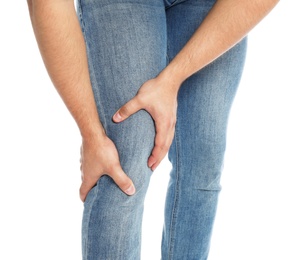 Photo of Man suffering from knee pain on white background, closeup