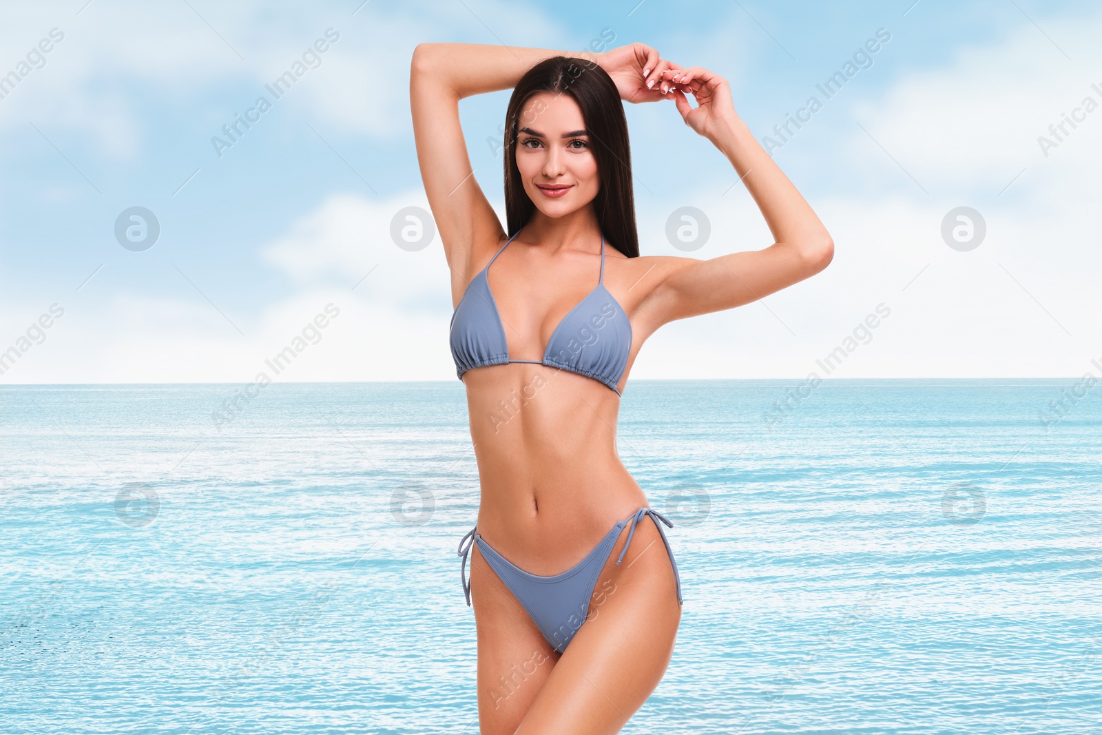 Image of Smiling woman in stylish bikini near sea